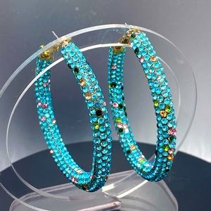 Love the crystal hoops gold tone with mostly blue and multi crystal color